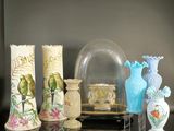 many vases that are sitting on a table