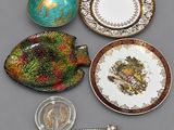 many different plates and spoons that are sitting on a table