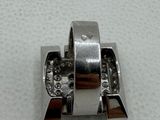 a close up of a metal object on a white surface