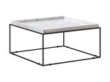 une table basse en marbre blanc avec un piètement en métal noir