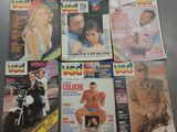 plusieurs couvertures de magazines représentant des hommes et des femmes, exposées sur une table