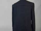 the back view of a black jacket on a mannequin mannequin mannequin mannequin mannequin mannequin mannequin manne
