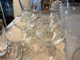 a lot of empty wine glasses on the table