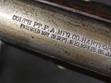 a close up of a gun that is on display on a table