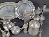 a lot of silver items that are on a table