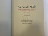 the book is open on a white surface with a white background