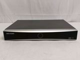 a close up of a black dvd player on a white surface