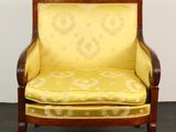 yellow upholstered chair with wood frame and upholstered seat