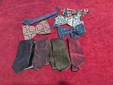 a lot of ties laid out on a red surface