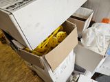a box with a bunch of bananas in it sitting on the floor