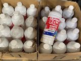 two boxes full of bottles of water and a bottle of yogurt