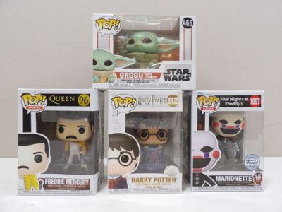 three pop vinyl figures of the child yoda, the child yoda, and the child yoda are