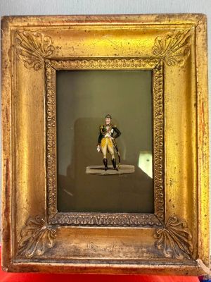 a picture of a man sitting on a bench in a picture frame