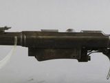 an old gun with a key hanging from it ' s side