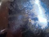 a close up of a metal object with writing on it