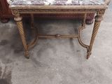 a small table with a glass top on it in a room