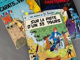 three children ' s books sitting on top of a table next to each other