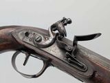 a close up of a gun on a white background with a gray background