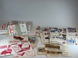 many different types of old postcards on the table