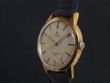 an image of a gold and black watch with a black strap