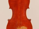 an old violin with a wooden back and a white background