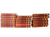books stacked on top of each other on a white surface