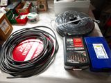 a table with a lot of wires and other items on it