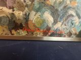 an image of a painting on a table with a blue table cloth