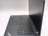 a black laptop computer sitting on a white surface