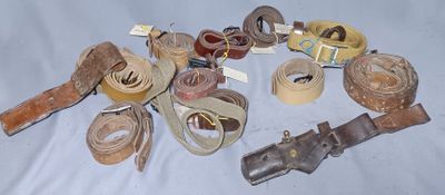 many different types of belts on a blue surface