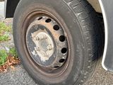 a black truck that has a flat tire on it