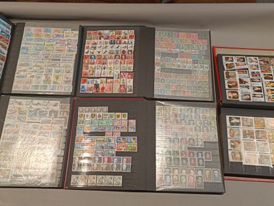 a lot of different stamps on a table together