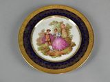 a plate with a picture of a woman and a man on it