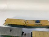 three toy trains sitting next to each other on a white surface
