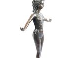 statue of a woman holding a flower in her right hand