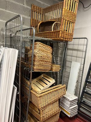 many baskets on the shelves in the room