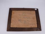 an old piece of paper with writing on it sitting on a table