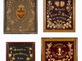 four framed plaques of different types and designs on a white background