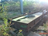 a trailer that is sitting in the dirt