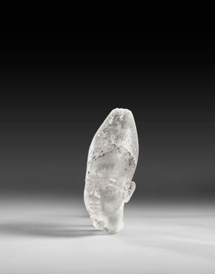 a close up of a rock on a white surface with a black background