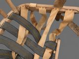 a close up of a wooden chair with a seat made out of wood