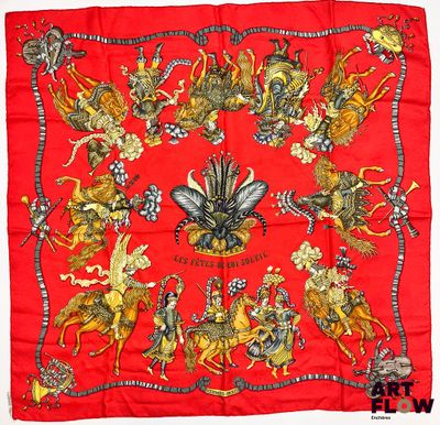 une image représentant un foulard en soie rouge orné d'un motif représentant un cheval et une calèche