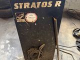 a black machine that is sitting on the floor