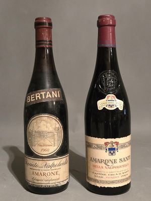 two bottles of wine sitting next to each other on a table