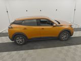 a yellow suv parked in a garage with a checkered floor