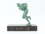statue of a man holding a baseball bat on a marble base