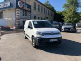 a white van that is parked in front of a building