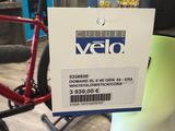a red bicycle with a price tag attached to it
