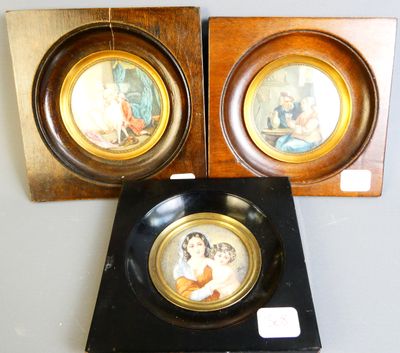 two framed pictures of a woman and a child in a wood frame