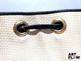 a close up of a white purse with a black handle